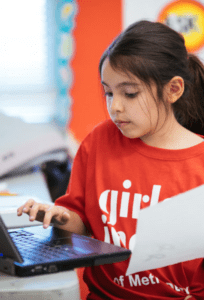 Girl typing on a laptop