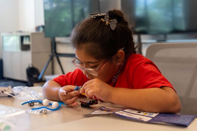 Girl creating science project